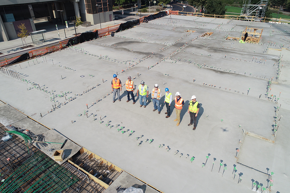 construction workers on a roof building site